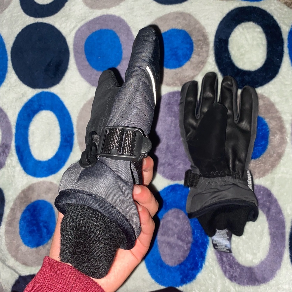 Black and grey Winter water proof gloves.